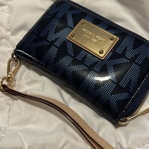 Michael Kors metallic blue wallet.   C718